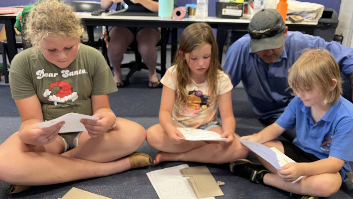 Hermidale students read letters from their penpals from Tanja Public School. Picture supplied